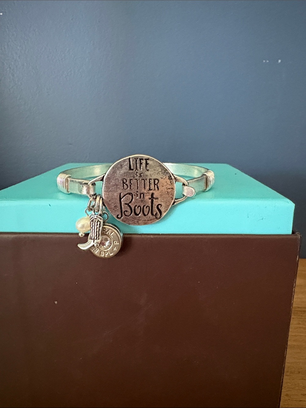Silver metal  'Life is Better in Boots' Charm Bangle with 38 special bullet.